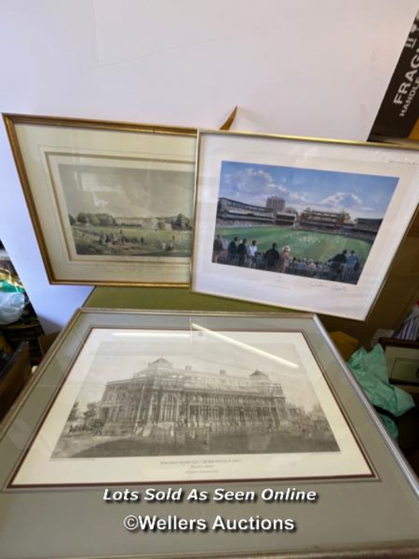 THREE FRAMED AND GLAZED CRICKET RELATED PRINTS, INCLUDING THE NEW PAVILION AT LORDS. THE LARGEST