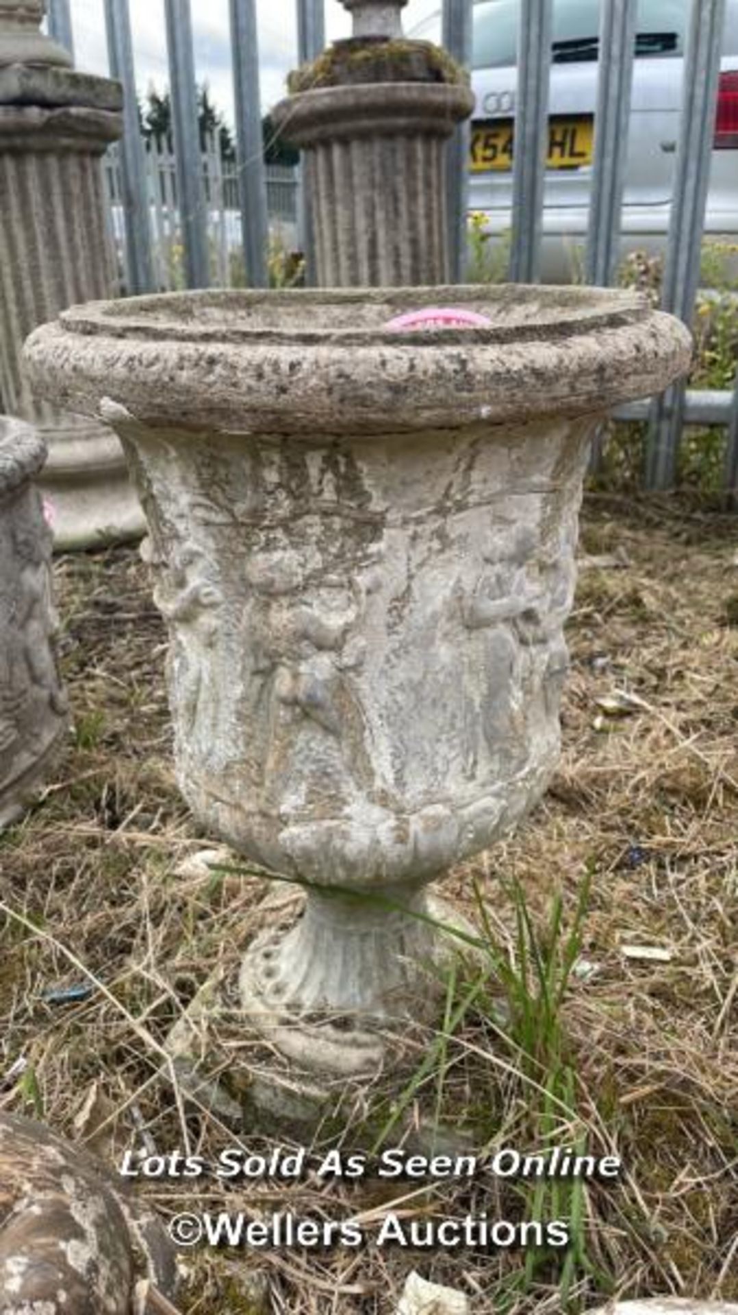 *RECONSTITUTED STONE URN PLANT POT WITH PRANCING CHERUBS, 50CM (H) X 34CM (DIA) / COLLECTION