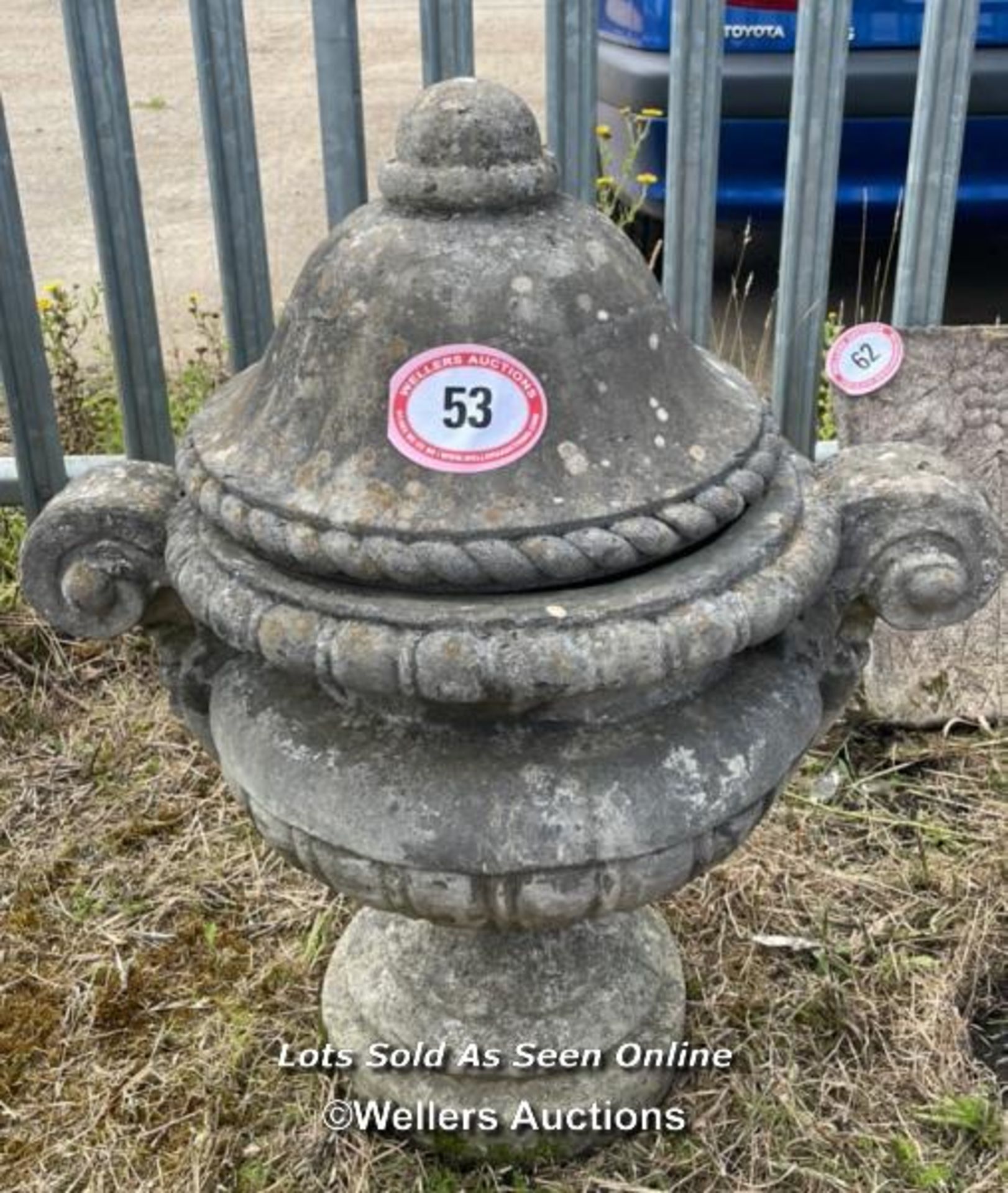 *RECONSTITUTED STONE TWO PIECE URN, WITH ROPE LID AND DRAPERY HANDLES, 86CM (H) X 77CM (DIA) /