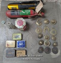 Mixed lot. Vintage fire extinguishers, horse brasses, tin with draughts pieces, old tins