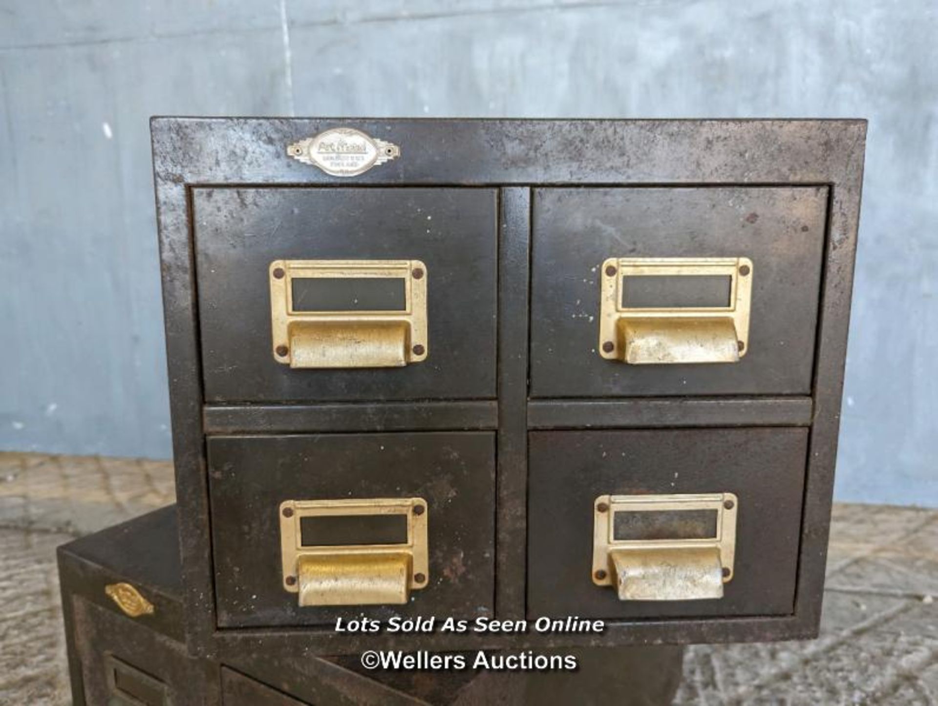 2 metal four drawer filing cabinets C1930 with brass handles/card holders. Some rust and paint loss