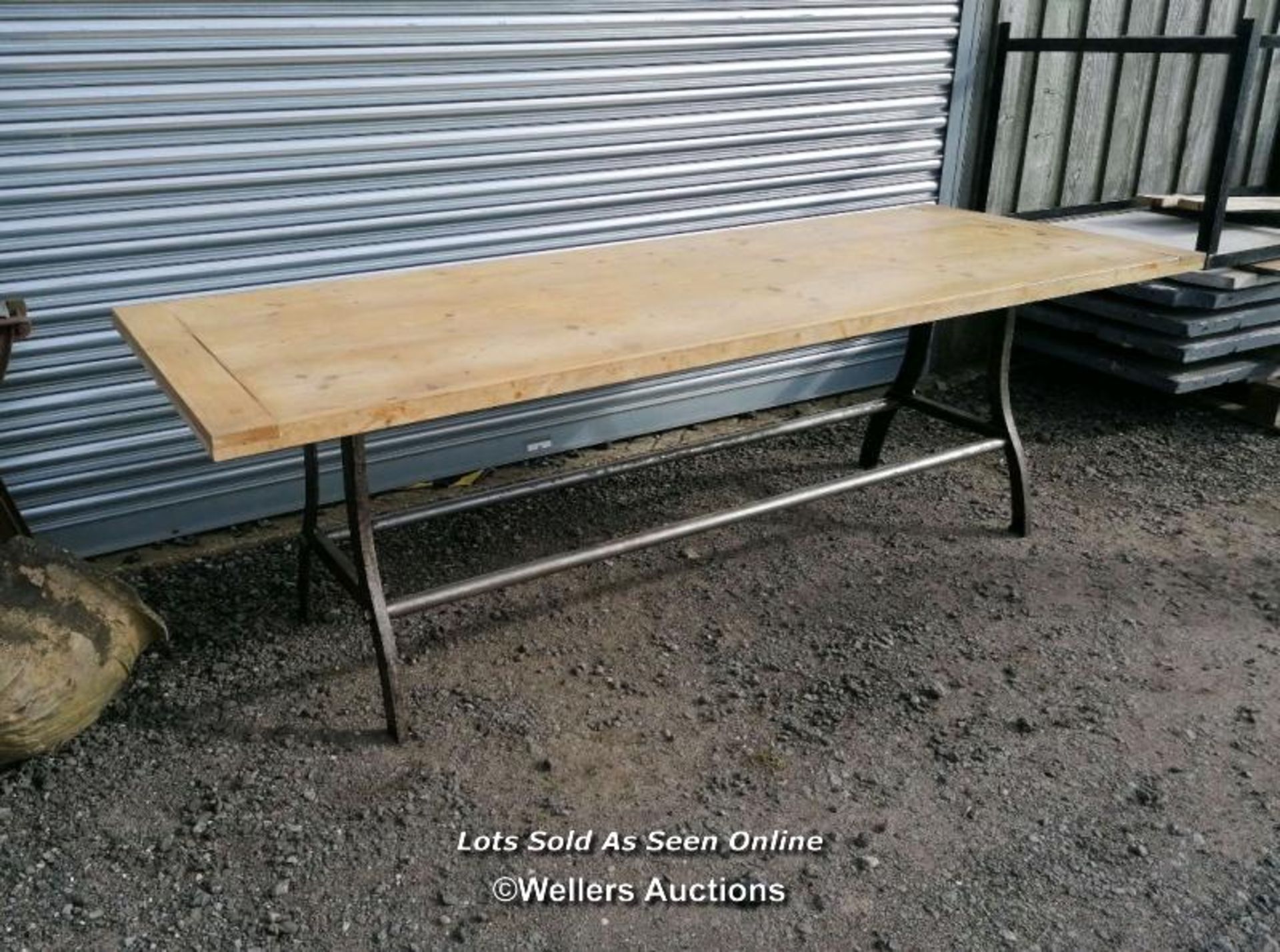 Dining table with cast iron base and reclaimed pine top. 8 to 10 seater. 240cm L x 88cm W x 76cm