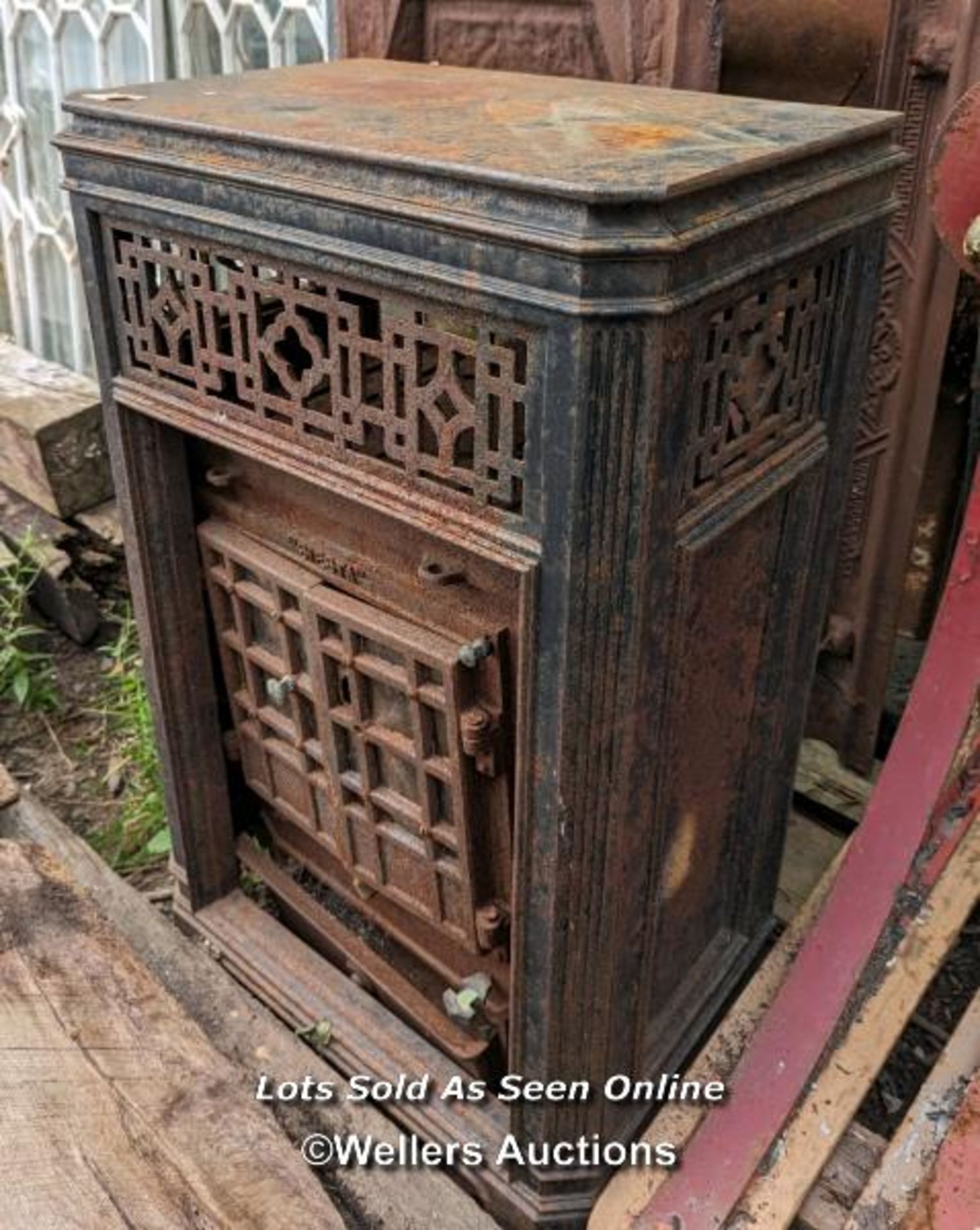 An Art Deco woodburning stove for restoration. Outer decorative removable frame in cast iron. 85cm H - Image 6 of 6