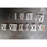 Set of cast iron roman numerals for use as a clock golf set. Each 9cm tall with spike to press