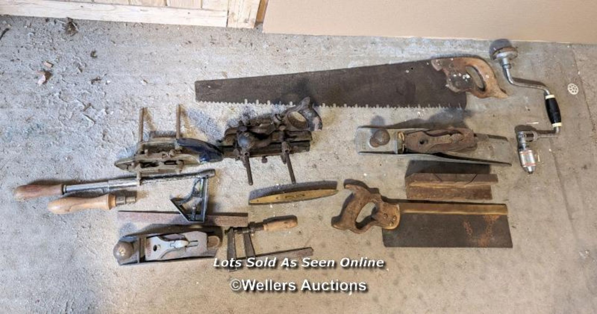 Batch of old wood working tools including planes, saws, bib and brace