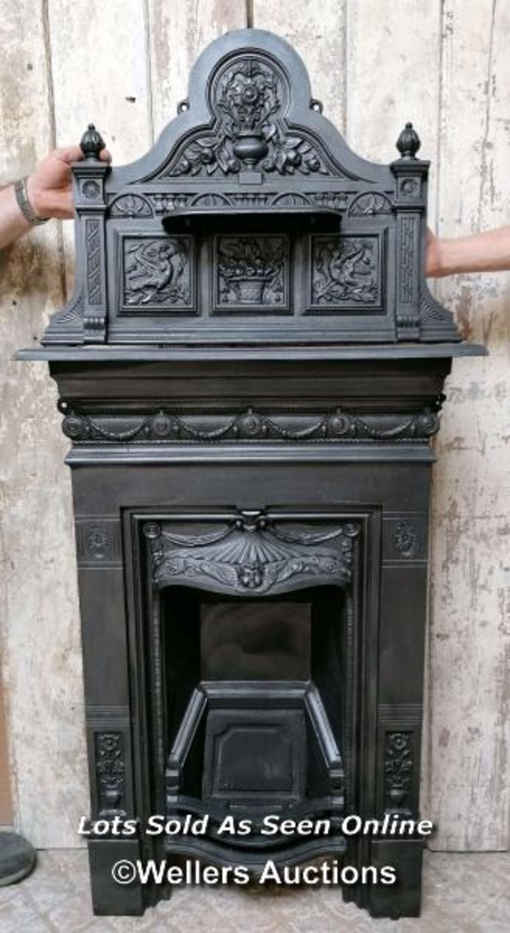 Original Victorian Cast iron bedroom fireplace. Combination design with decorative top with angel or