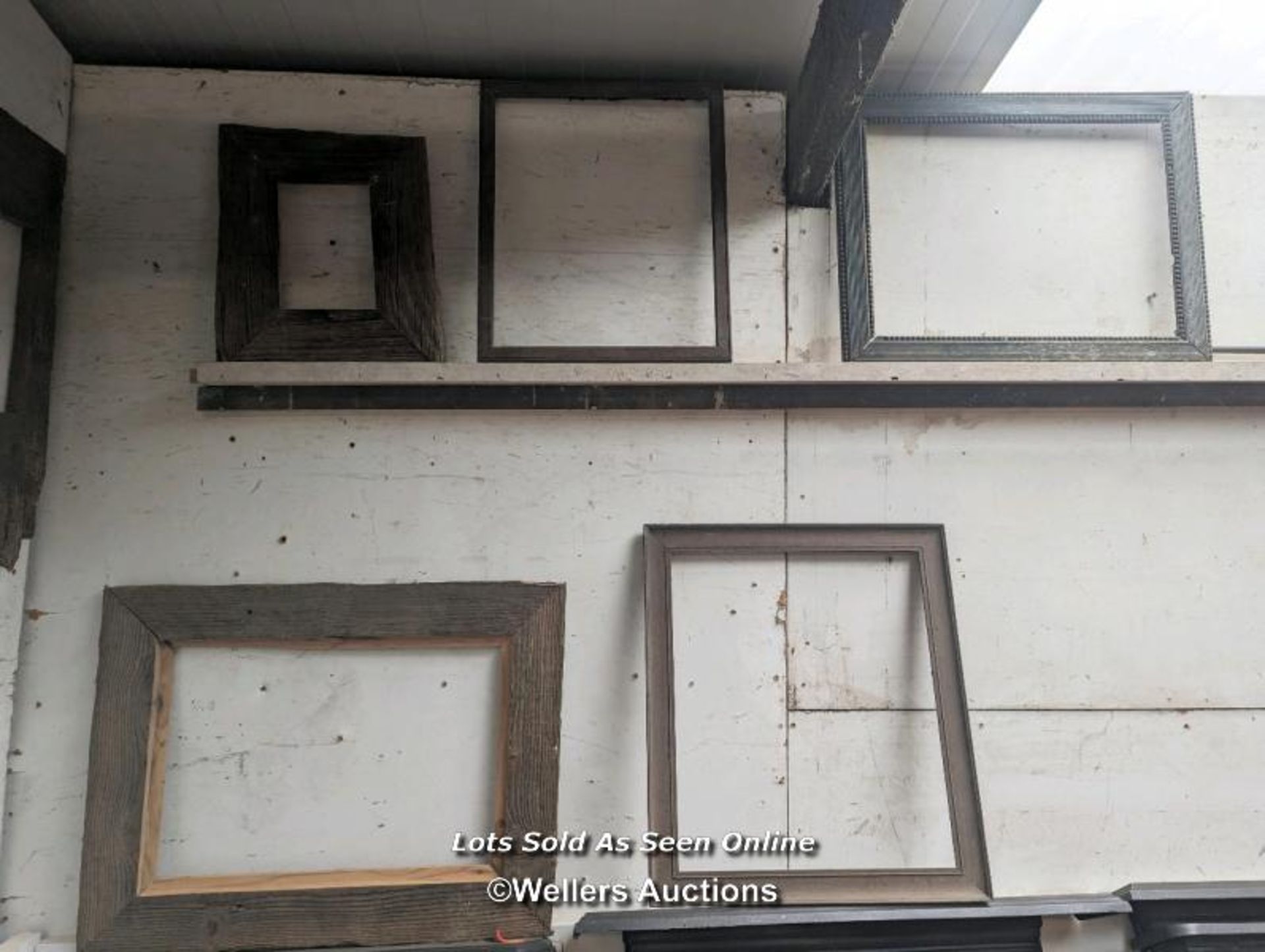 A collection of old picture frames and rustic timber frames needing restoration. Largest 54cm x 70cm