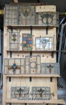 11 stained glass panels. Sizes from 28cm to 40cm by 40cm to 60cm. Some breaks and damage