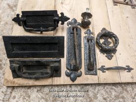 Selection of cast iron front door furniture including letterboxes, knockers, door pulls.