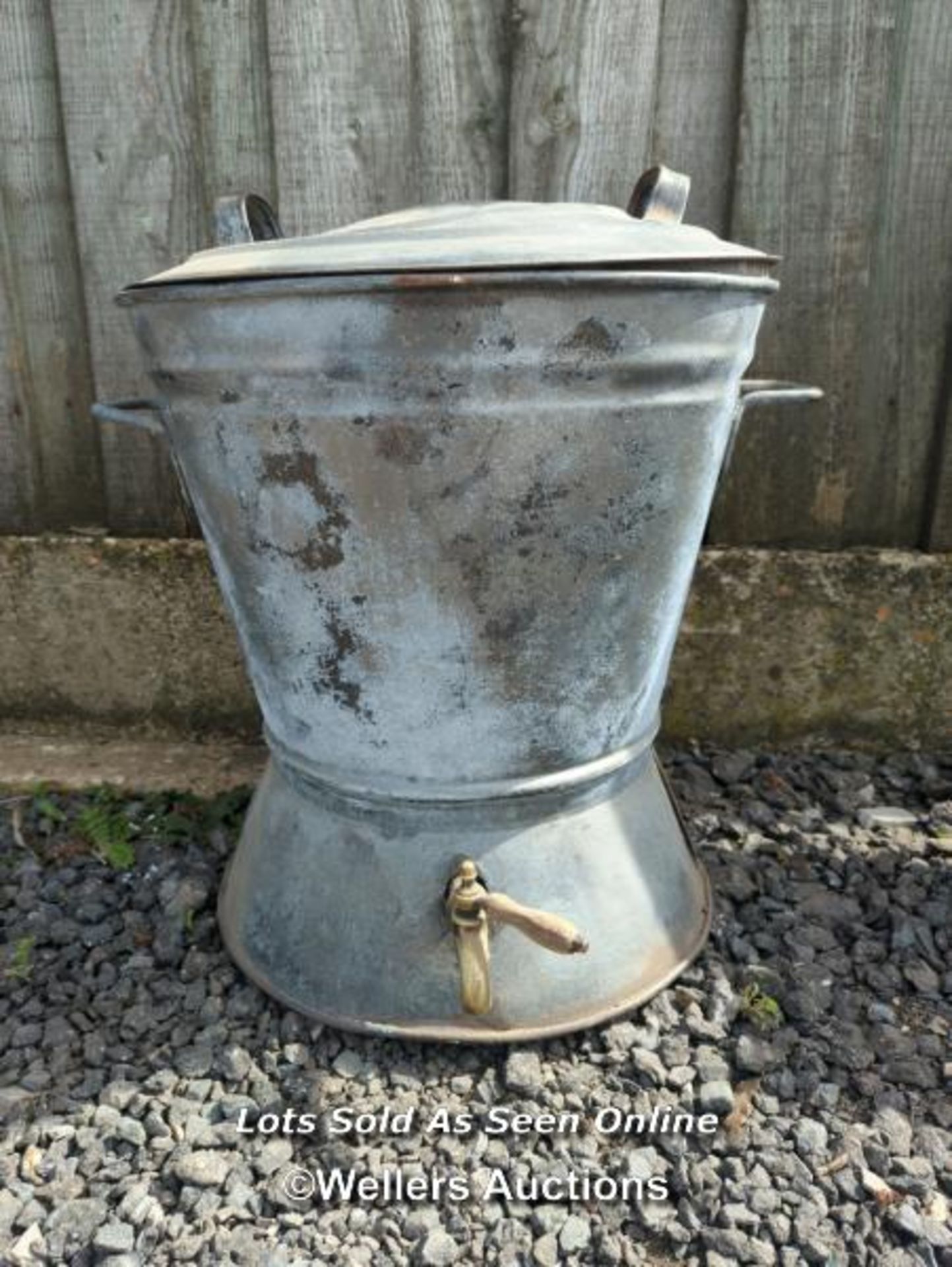 Galvanised washer, hopper or planter with brass tap (not tested) and lid. 52cm high. 48cm across.