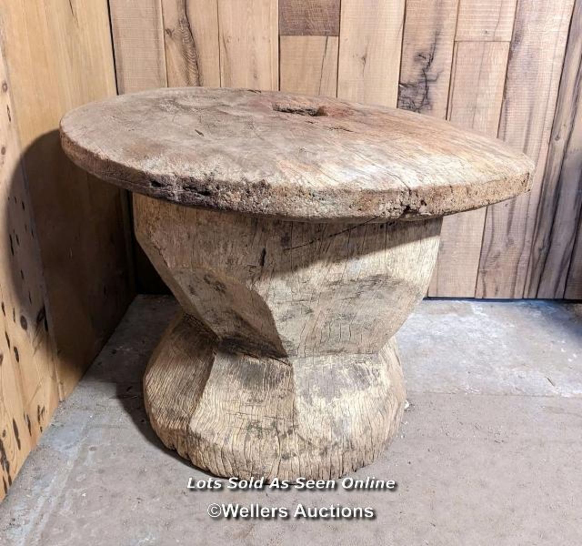 A very large grain mortar. West African. Hardwood. The lid (75cm across) had a hole, now patched