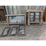 Batch of 5 reclaimed windows, two in oak surrounds. 3 opening cast iron ones