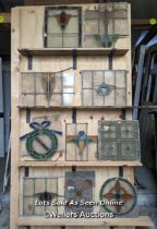 10 leaded stained glass panels in need of restoration. Some breaks in glass and lead missing.