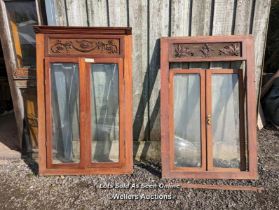 Two pairs of mahogany glazed doors each in a frame with handcarved header. From 1890 from HMS