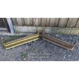 2 brass fire fenders. Polished fender is 87cm x 31cm. Unpolished fender is 82cm x 25cm