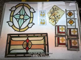 11 pieces of stained glass inc handpainted, leaded, bullseyes. Some damage and cracks. Largest piece