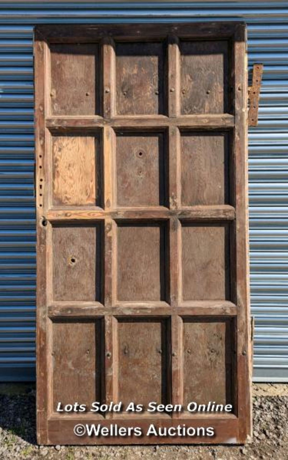 Very large pine Castle door. Pine paneled face with oak back panel. Large cast iron hinges. Size