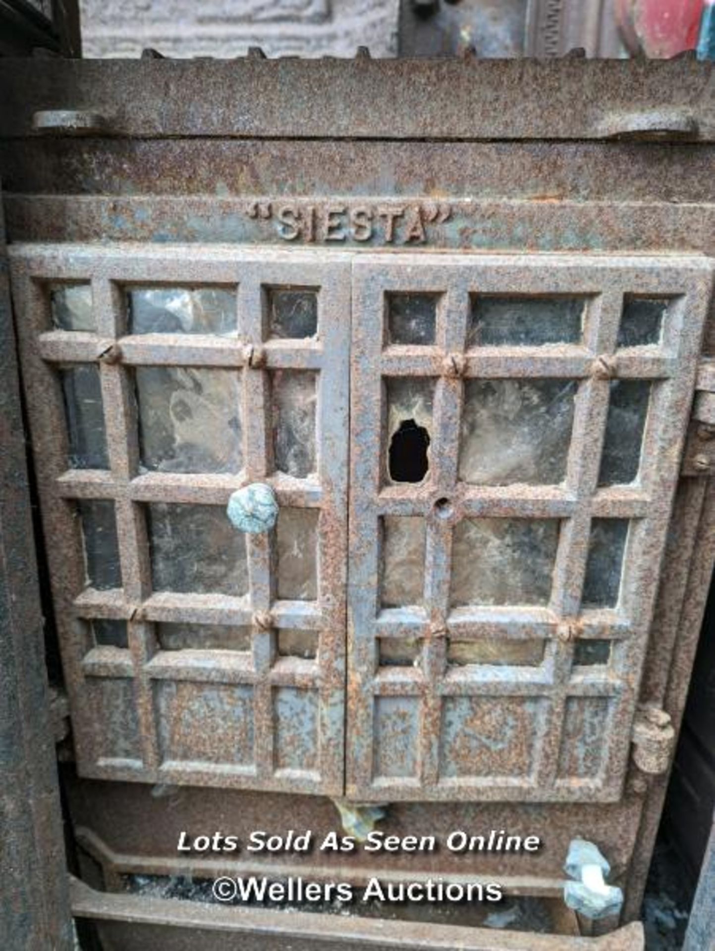 An Art Deco woodburning stove for restoration. Outer decorative removable frame in cast iron. 85cm H - Image 2 of 6