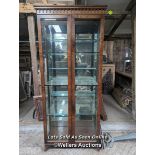 A solid walnut and veneered walnut display cabinet. Some veneer damaged and peeling. Mirrored back