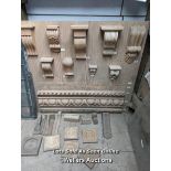 Board of hand carved corbels, wood carvings and extra pieces
