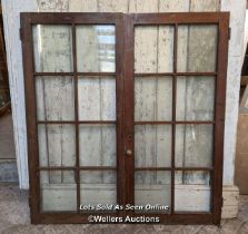 Pair glazed cupboard doors and three solid cupboard doors. All pine. One piece of glass missing.