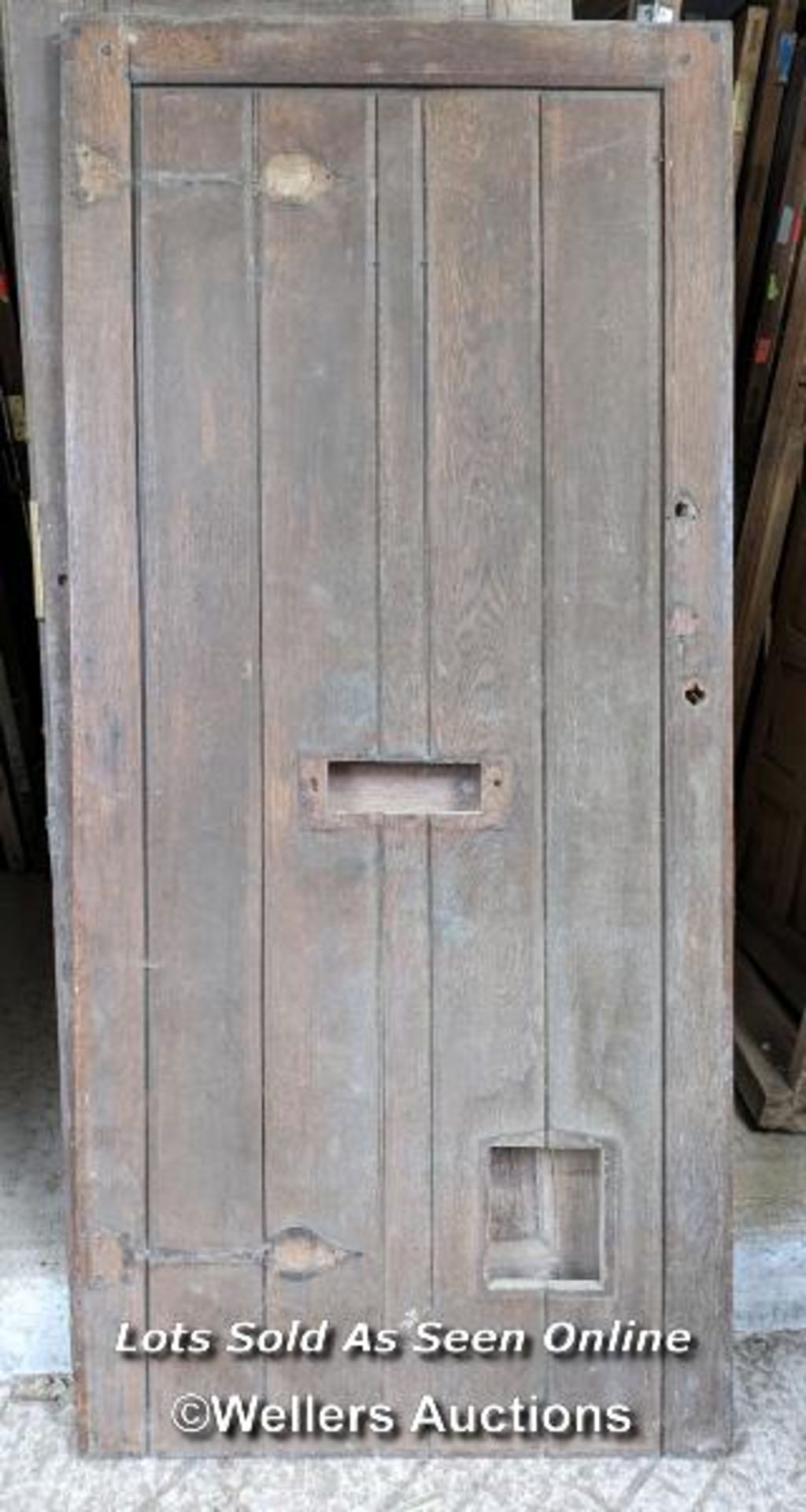 A Victorian oak cottage door for restoration. Previous owner has added baton to deal with plank