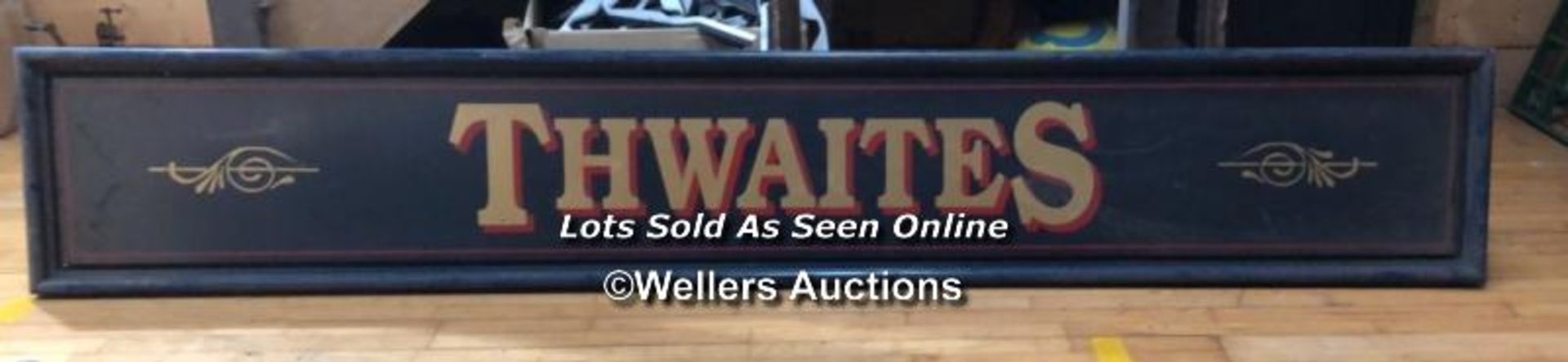 "THWAITES" PUB SIGN, 50CM (H) X 300CM (W) X 6CM (D), RECLAIMED FROM THE ORIGINAL THWAITES & CO.