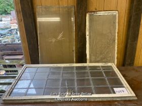 2X VINTAGE WINDOWS WITH CAST IRON FRAME AND ONE ART DECO STYLRE EMBOSSED GLASS PANEL, LARGEST