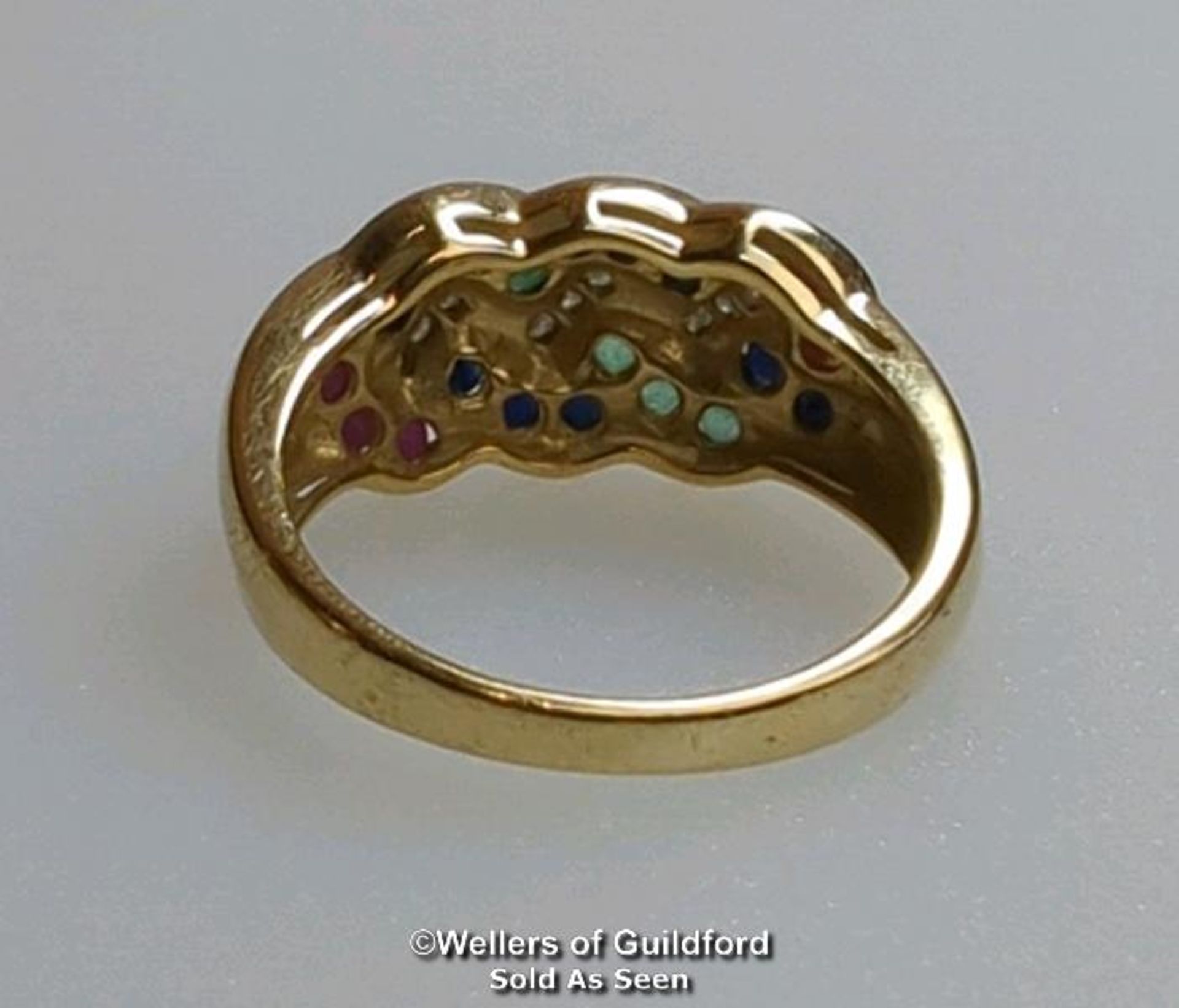 Diamond, sapphire, ruby and emerald knot ring in hallmarked 9ct gold. Diamond weight estimated as - Image 7 of 8