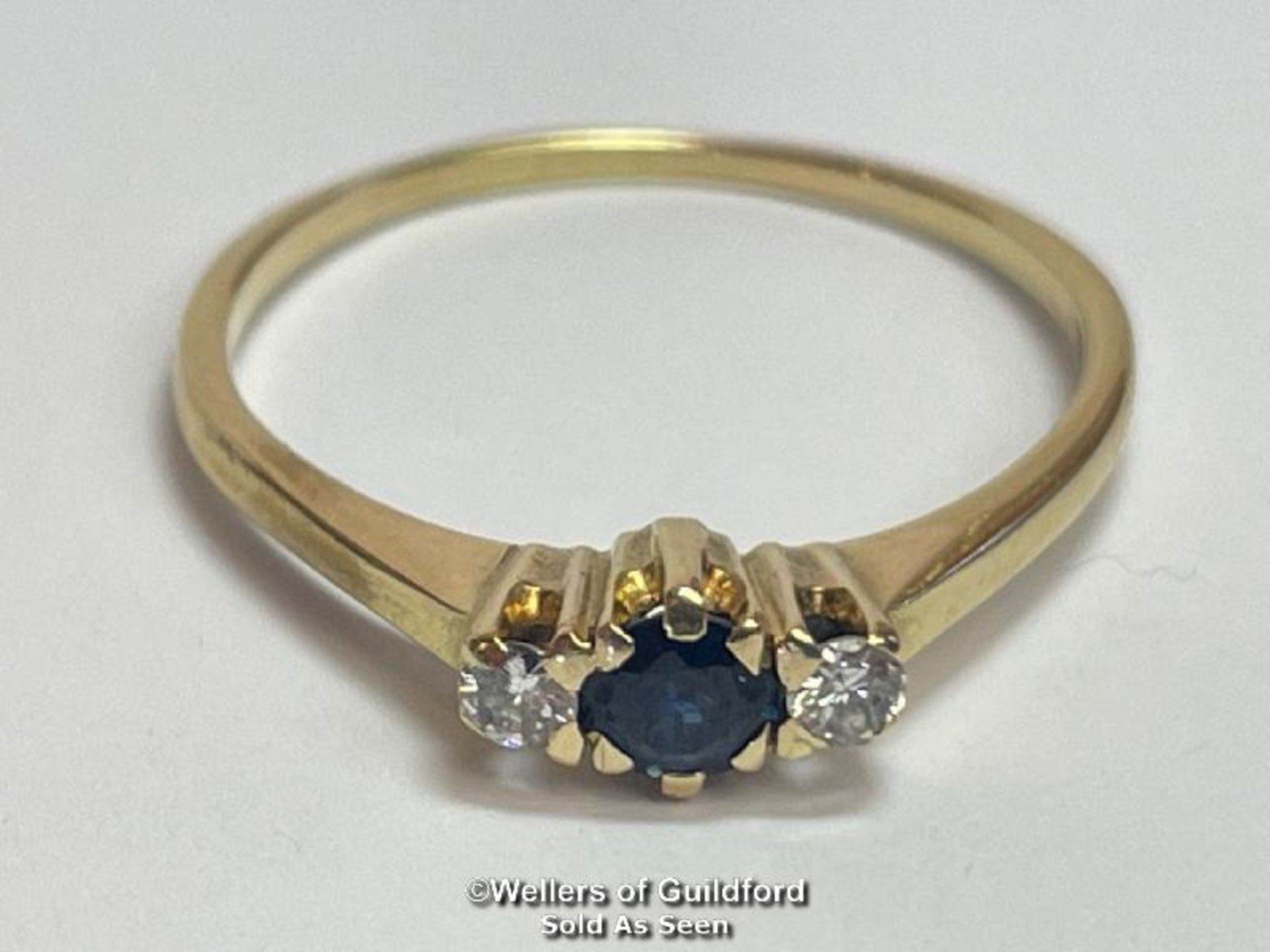Sapphire and diamond three stone ring in unmarked yellow metal. Estimated weight of sapphire 0.40ct, - Image 2 of 4