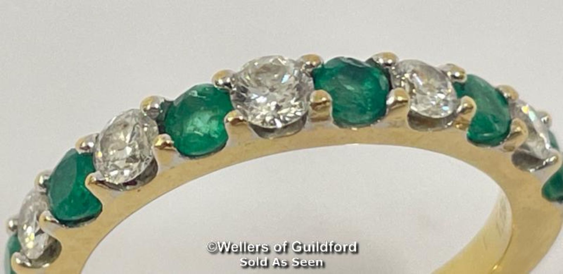 Emerald and diamond eternity half band stamped 18ct, ring size o, diamond weight 0.40ct estimated
