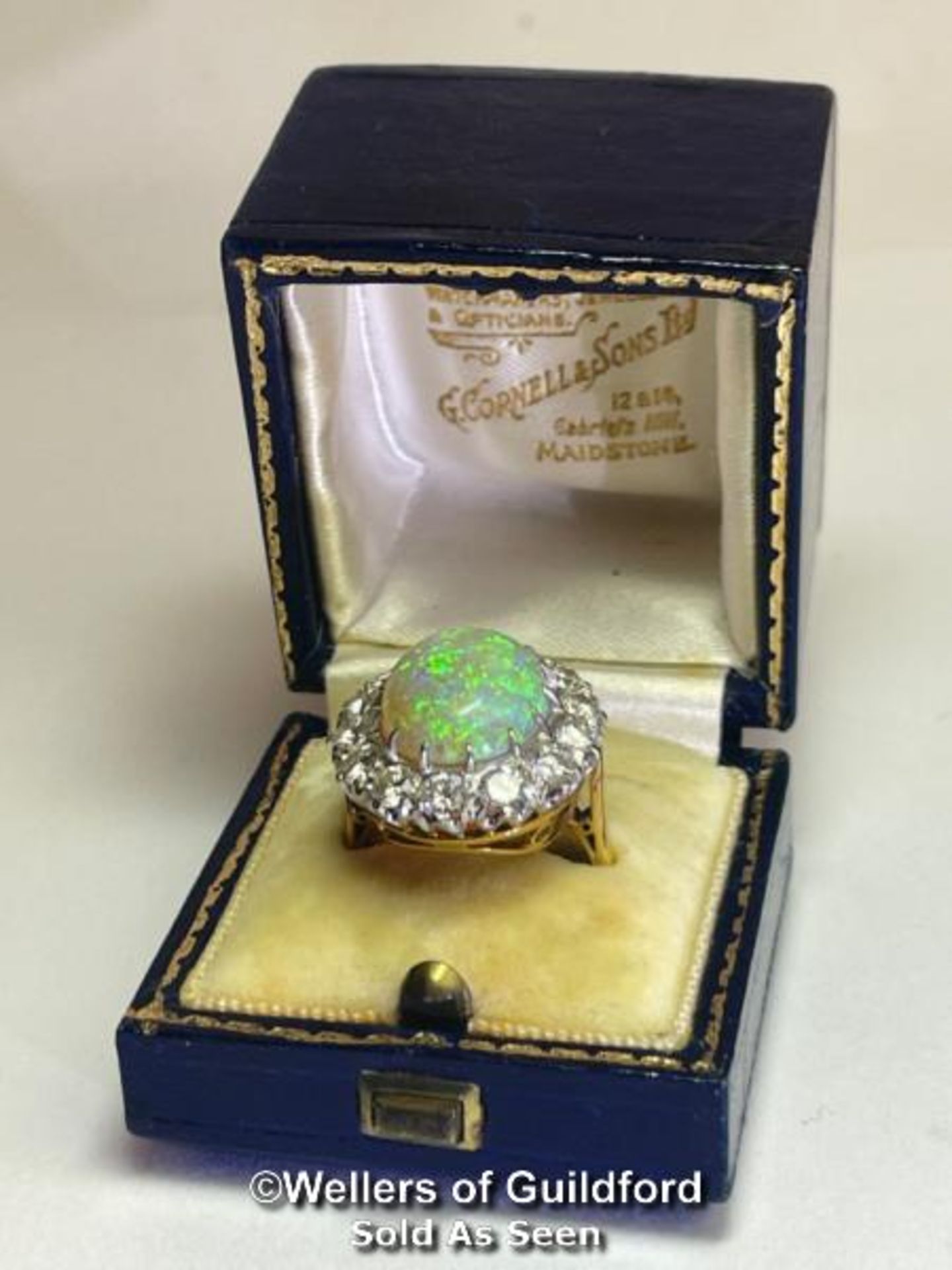 Opal and diamond cluster ring with an oval opal measuring 14.6mm x 12.2mm surrounded by 14 round - Image 8 of 8