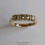 Five stone cubic zirconia ring in hallmarked 9ct gold. Diameter of stones 3.2mm. Ring size R1/2.