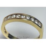 Diamond channel set eternity half band ring in hallmarked 18ct gold. Estimated diamond weight 0.