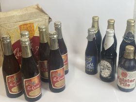 Twelve assorted bottles of beer. Including Guiness, Queens Ale, and more / Please see images for