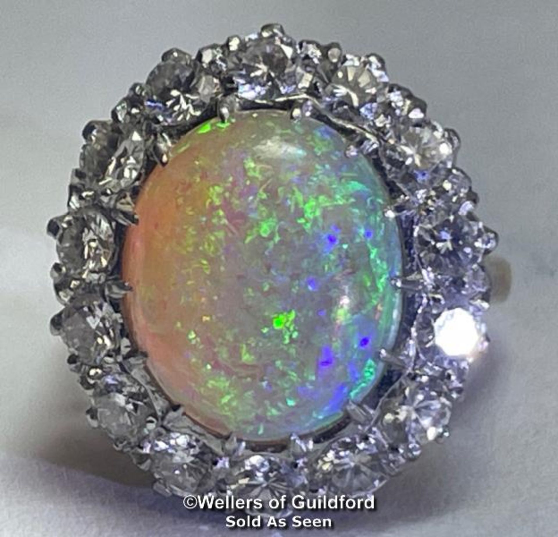 Opal and diamond cluster ring with an oval opal measuring 14.6mm x 12.2mm surrounded by 14 round - Image 3 of 8