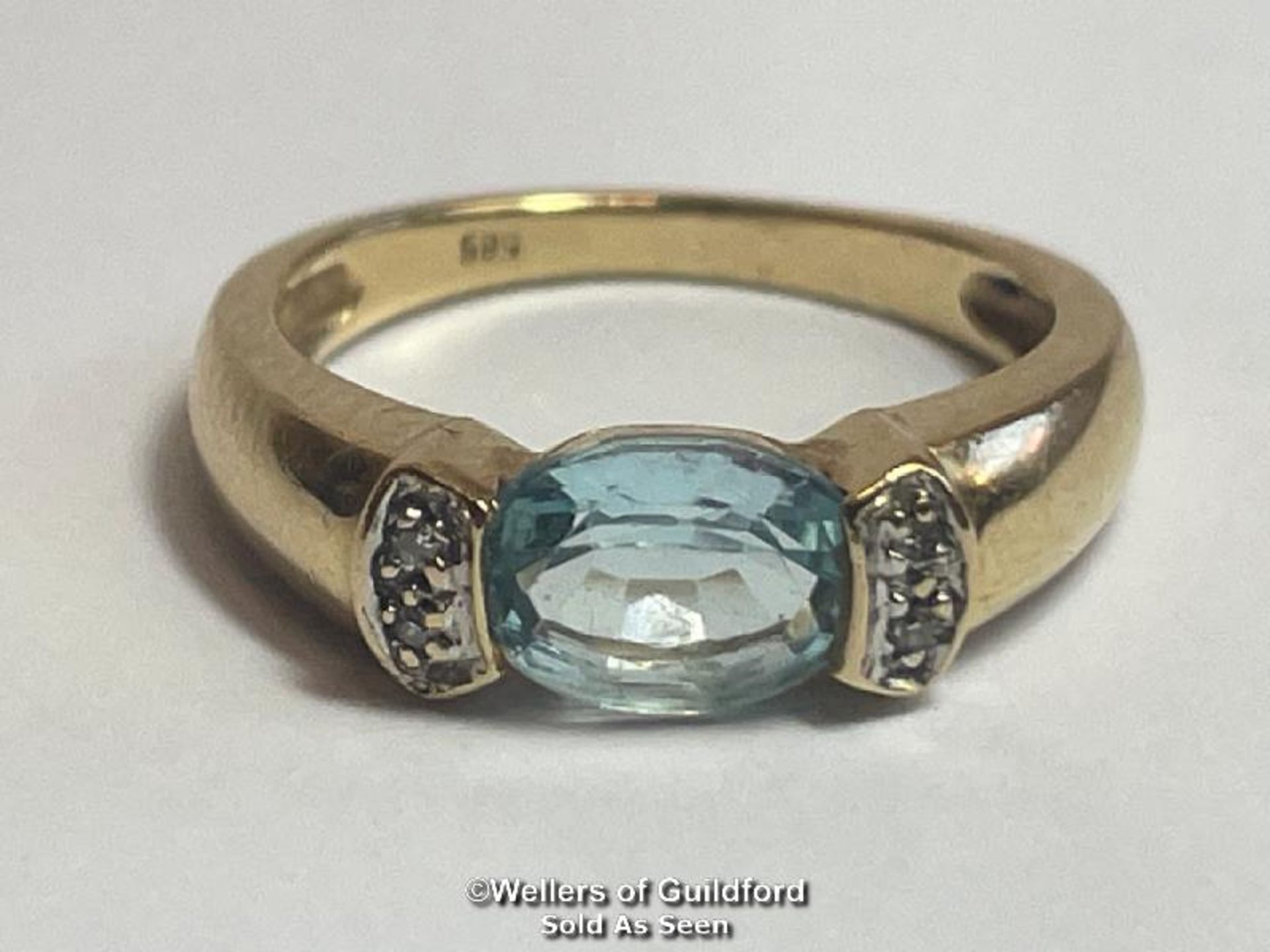 Oval blue topaz (untested) ring in yellow metal stamped 585, with diamond accents. Ring size K1/2, - Image 2 of 5