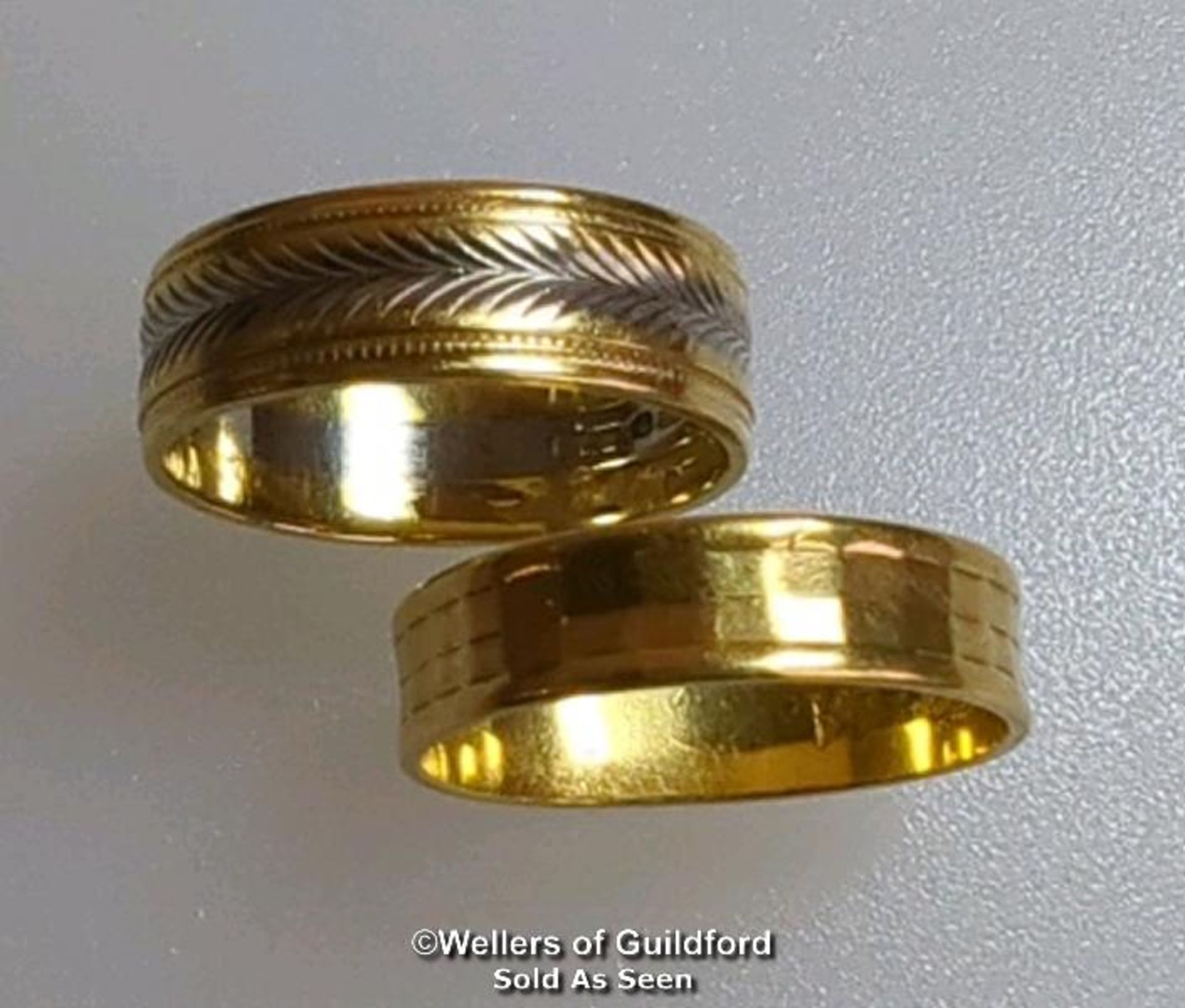 Two wedding bands. One hallmarked 22ct gold, London 1963, ring size M, gross weight 2.81g. The other