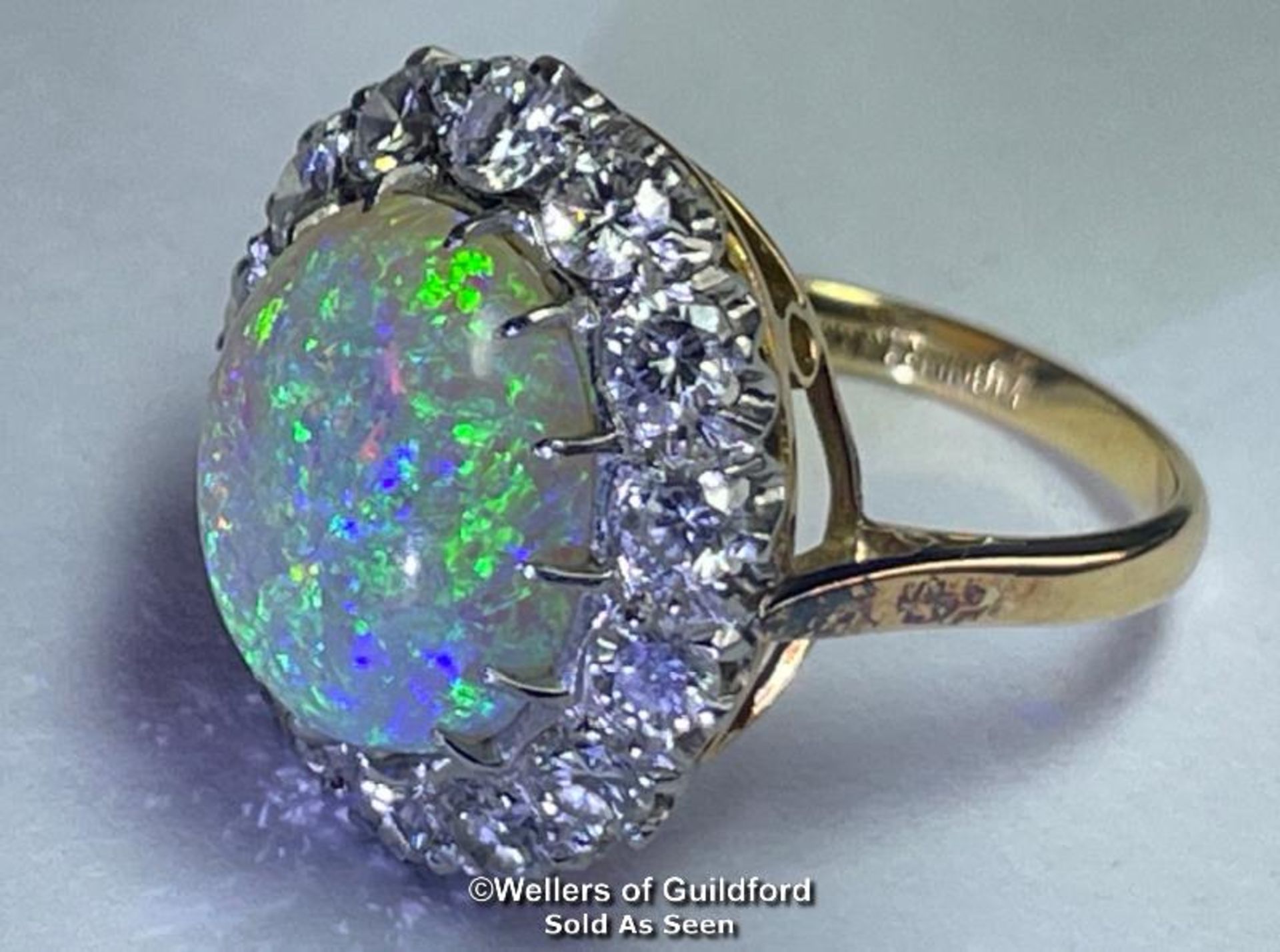Opal and diamond cluster ring with an oval opal measuring 14.6mm x 12.2mm surrounded by 14 round - Image 2 of 8