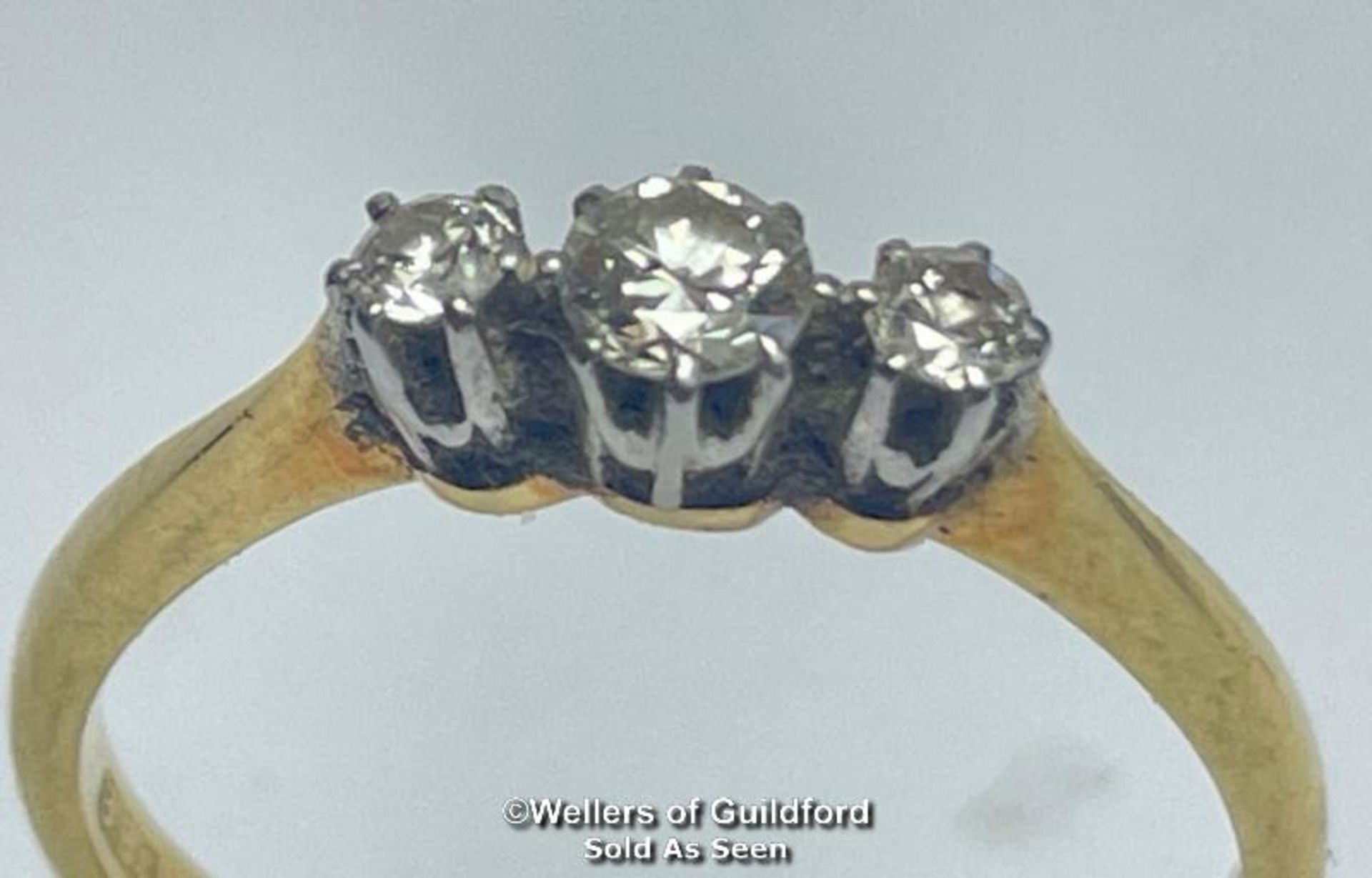 Diamond three stone ring. Estimated total diamond weight 0.22ct. Shank stamped 18ct and PT. Ring