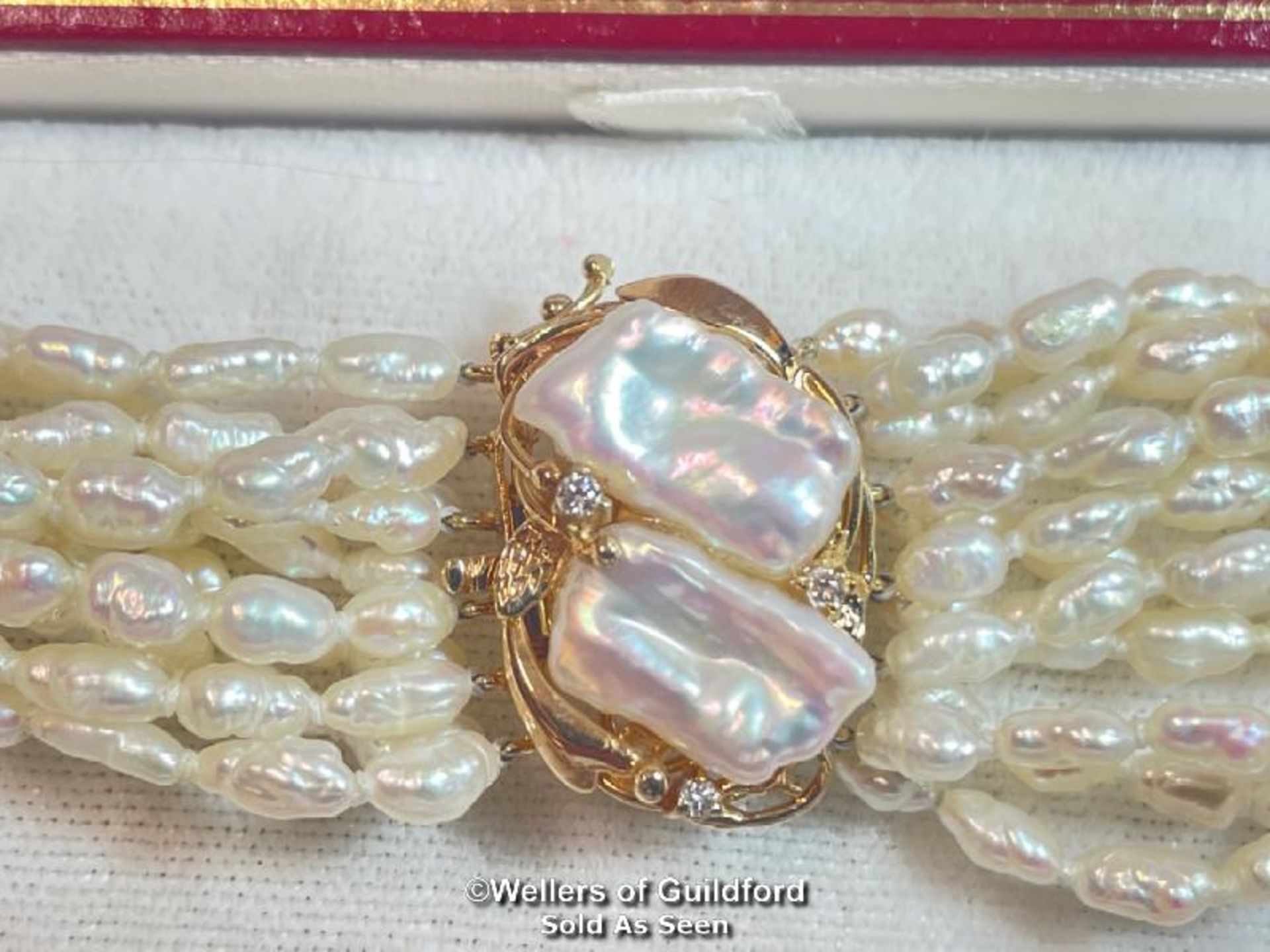 A multi row necklace of eleven rows of cultured freshwater rice pearls strung to clasp set with - Image 3 of 6