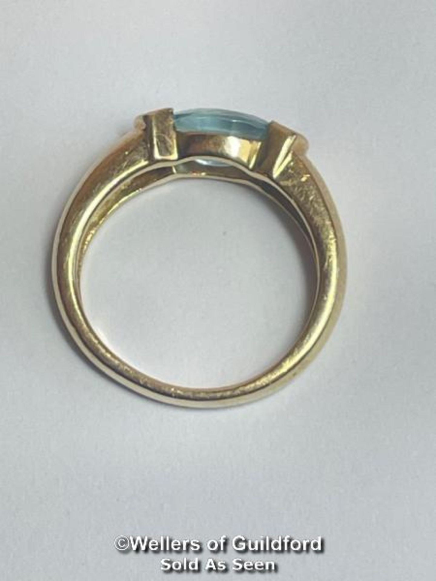Oval blue topaz (untested) ring in yellow metal stamped 585, with diamond accents. Ring size K1/2, - Image 3 of 5