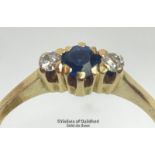 Sapphire and diamond three stone ring in unmarked yellow metal. Estimated weight of sapphire 0.40ct,