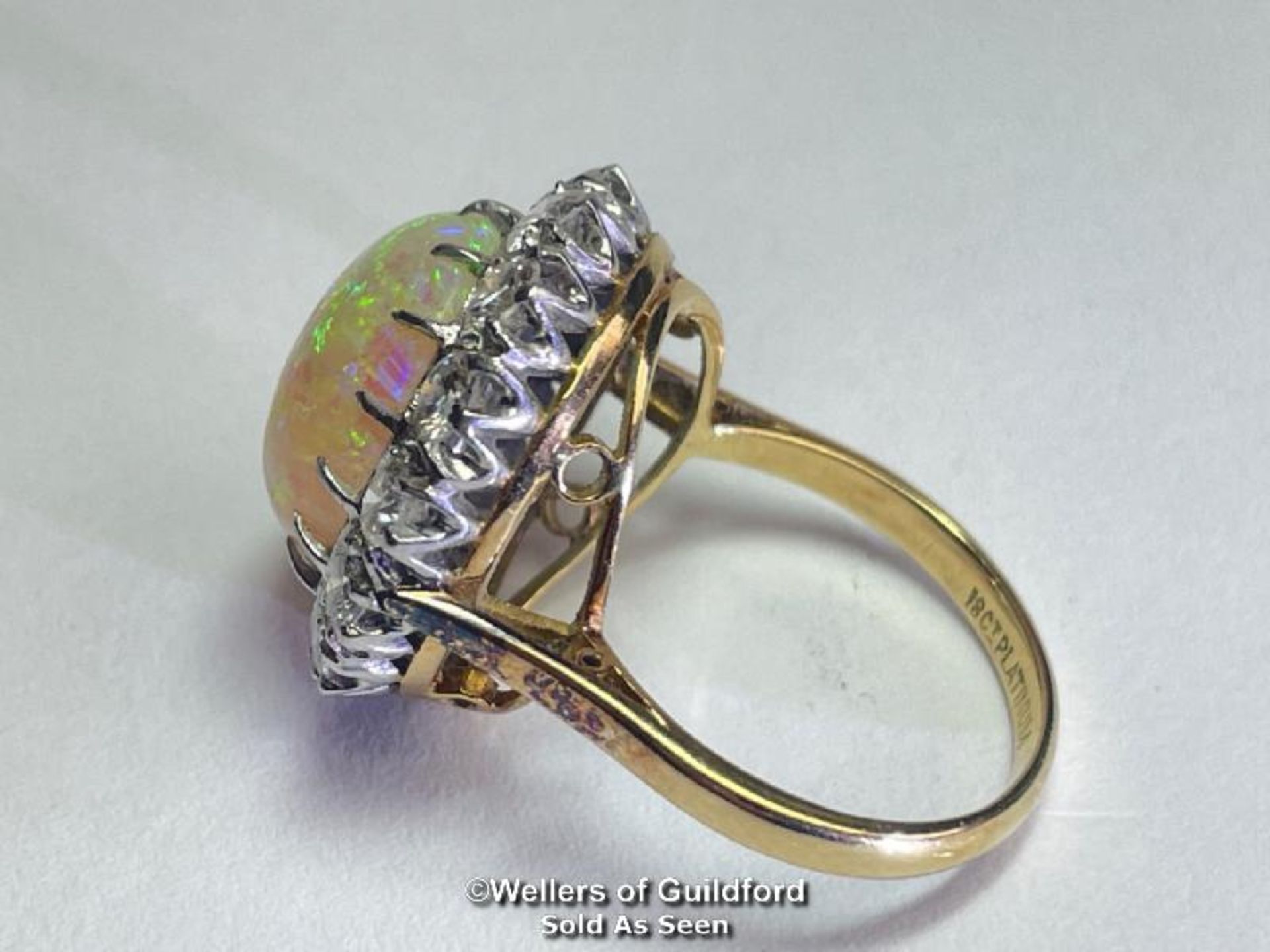 Opal and diamond cluster ring with an oval opal measuring 14.6mm x 12.2mm surrounded by 14 round - Image 5 of 8