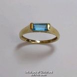 Blue topaz (untested) single stone ring in hallmarked 9ct gold, by QVC. The baguette cut stone