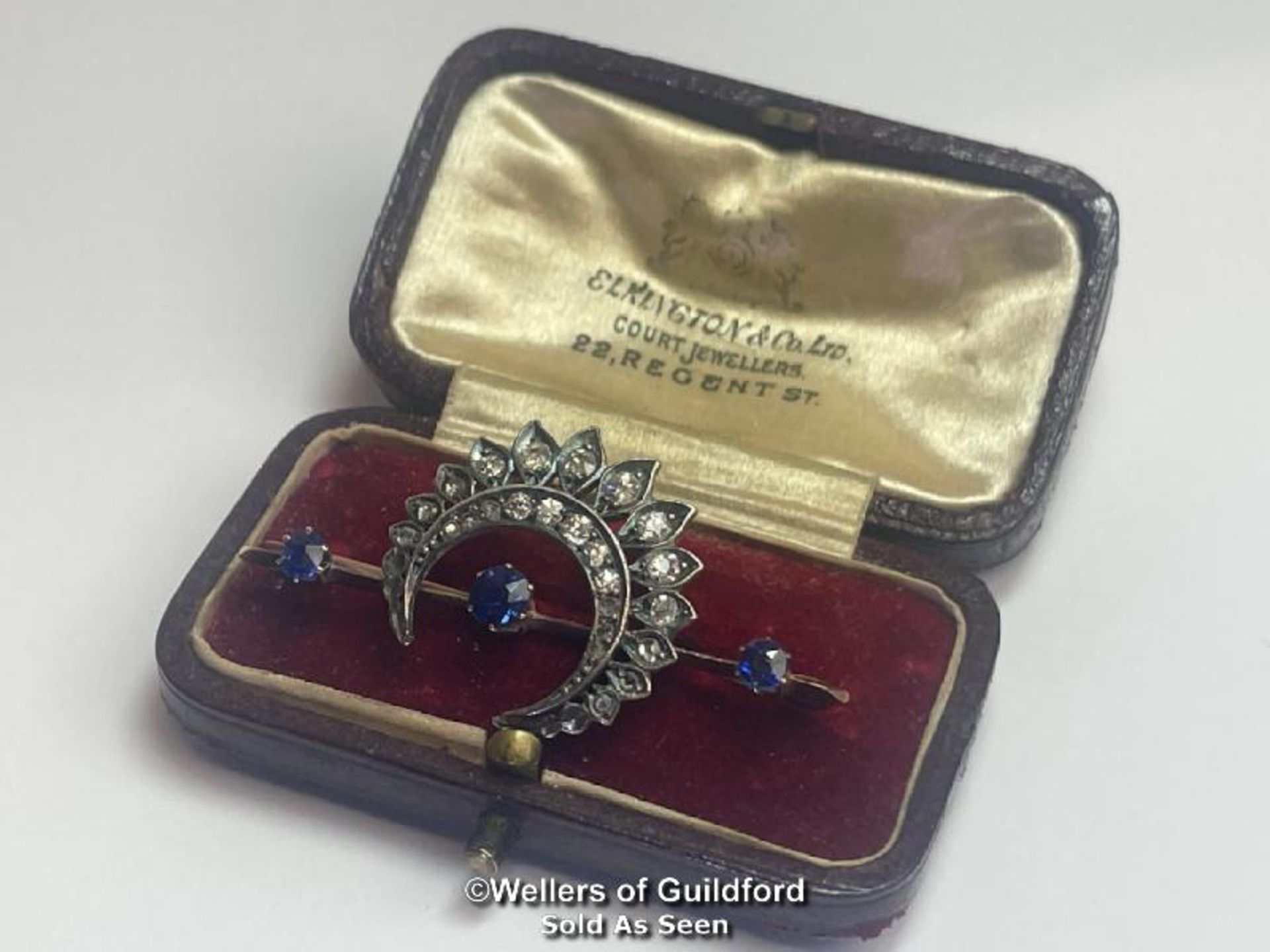 Late Victorian diamond and sapphire cresent bar brooch. Three round old cut sapphires estimated - Image 5 of 5