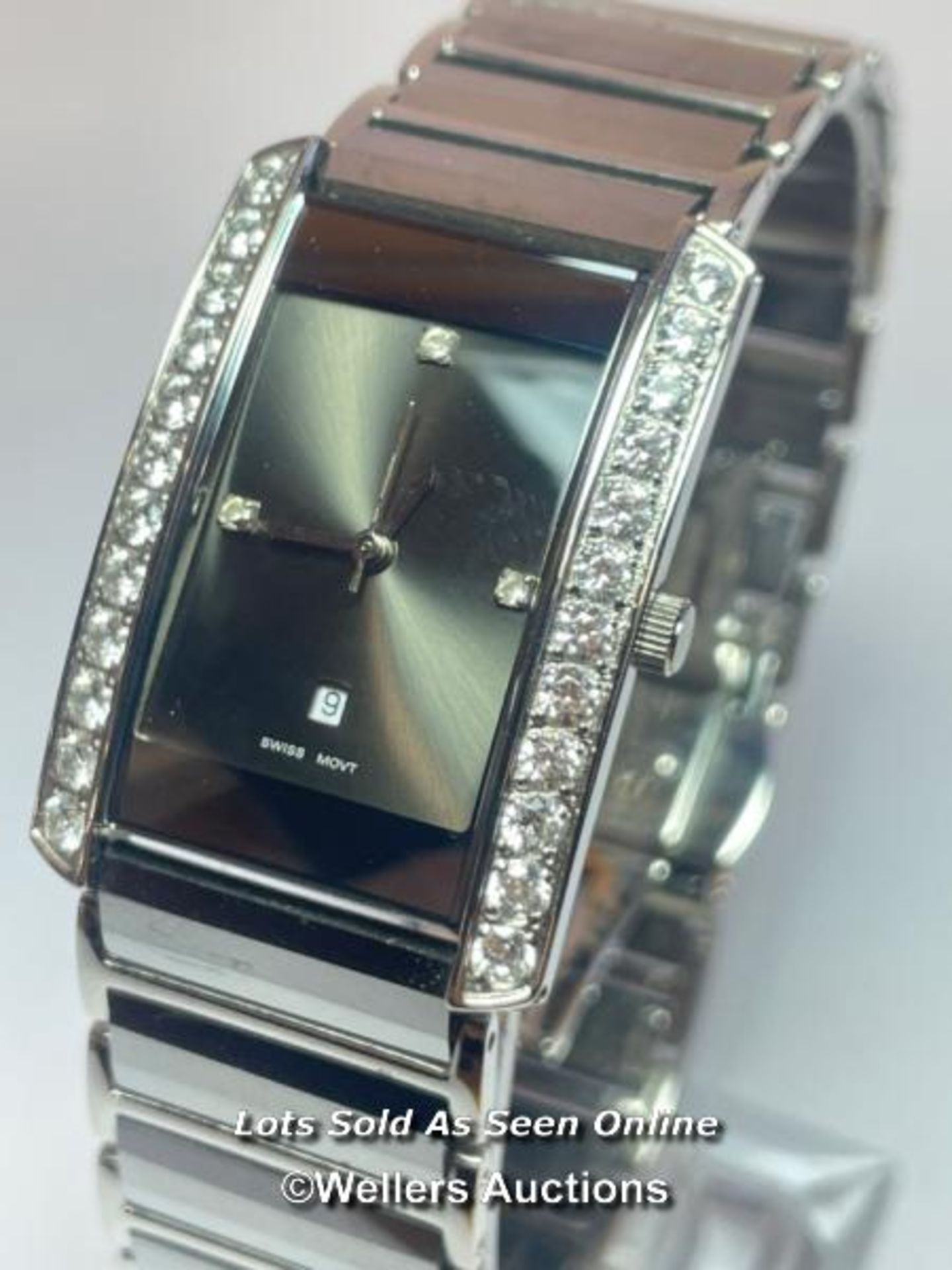 Tungsten wristwatch, quartz movement, tank style case with cubic zirconia borders on mirror