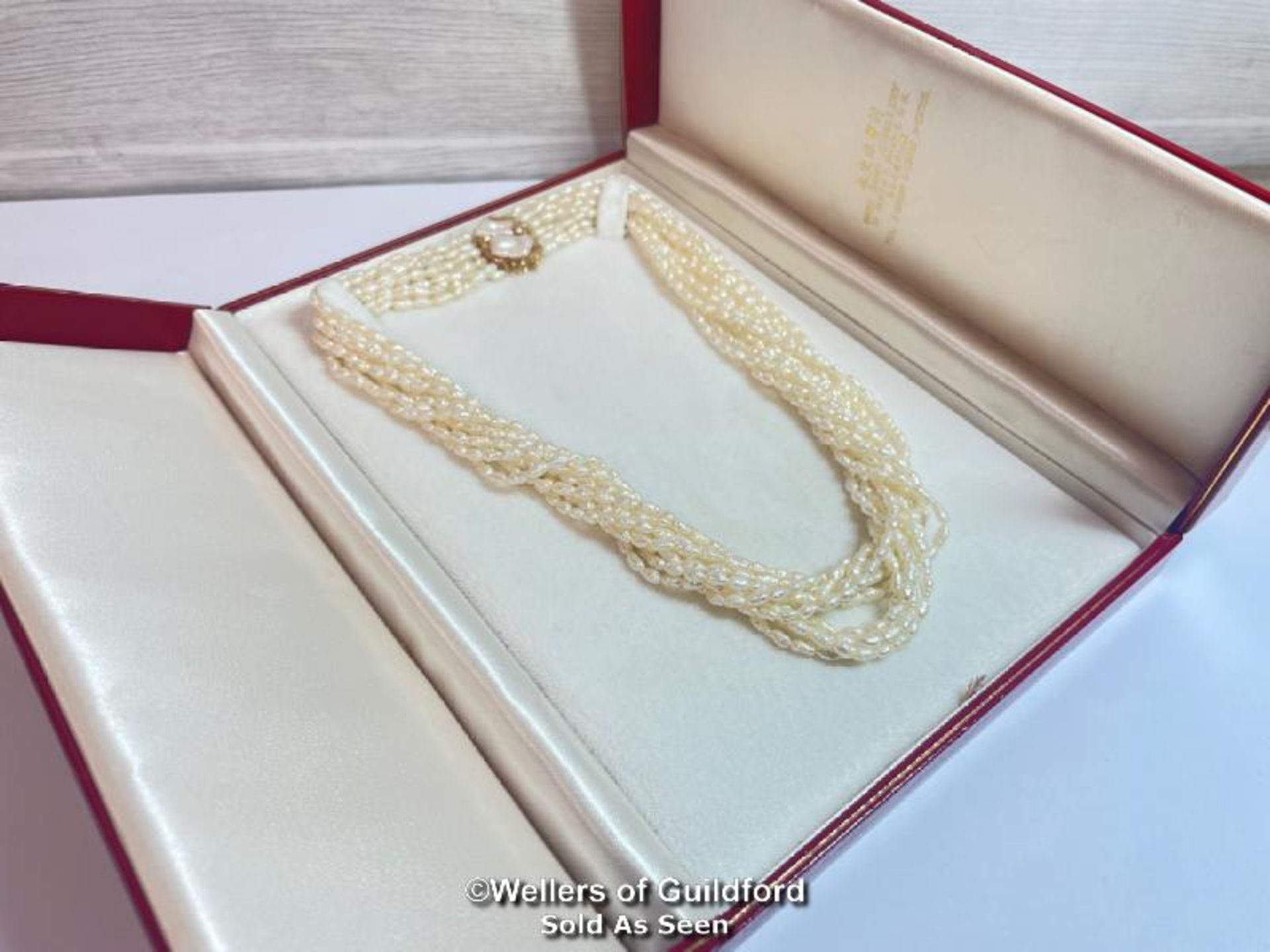 A multi row necklace of eleven rows of cultured freshwater rice pearls strung to clasp set with - Image 6 of 6