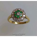 Emerald and diamond round cluster ring in hallmarked 18ct gold. Central brilliant cut diamond