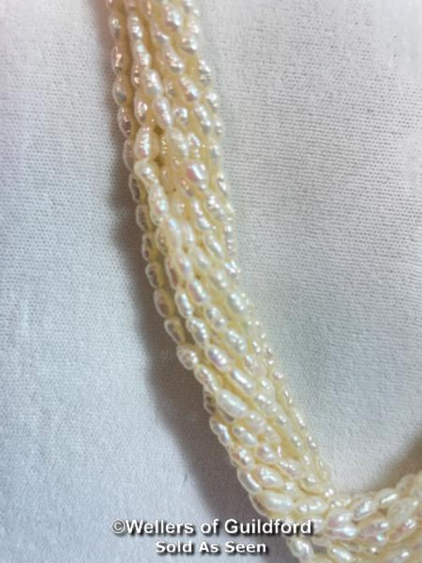 A multi row necklace of eleven rows of cultured freshwater rice pearls strung to clasp set with - Image 2 of 6